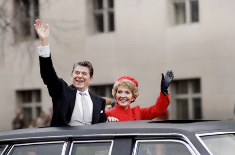 U.S. President Ronald Reagan and U.S. First Lady Nancy Reagan waving from limousine during