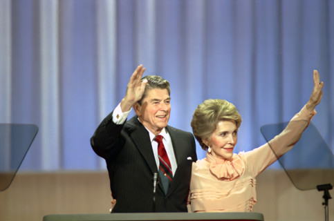 U.S. President Ronald Reagan and U.S. First Lady Nancy Reagan waving to the crowd from podium