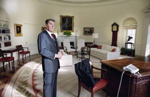 U.S. President Ronald Reagan standing in the White House Oval Office for the last time as U.S.