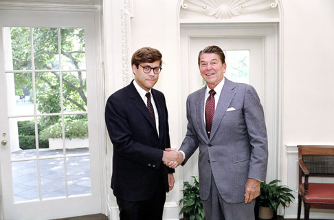 U.S. President Ronald Reagan and Deputy Assistant Director for Legal Policy William Barr shaking