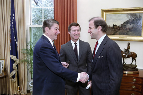 U.S. President Ronald Reagan meeting with U.S. senators Joseph Biden and William Cohen to discuss