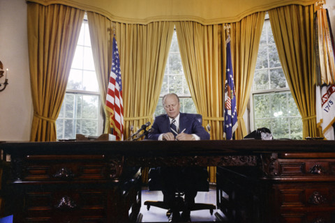 U.S. President Gerald R. Ford signing proclamation granting pardon to former U.S. President Richard