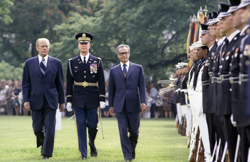 U.S. President Gerald R. Ford and Shah Mohammad Reza Pahlavi of Iran reviewing U.S. military troops