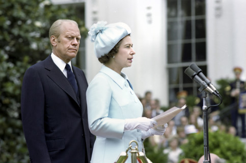 U.S. President Gerald R. Ford listening to Queen Elizabeth II delivering remarks at a State arrival