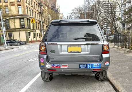 Parked car with various political bumper stickers, Manhattan, New York City, New York, USA