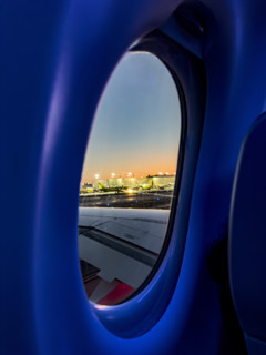 View of airport through window of Jet Blue Airlines commercial airplane, Fort Lauderdale-Hollywood