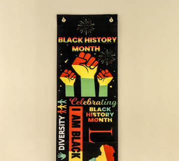Black History Month banner hanging on wall