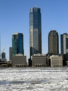 View of Jersey City, New Jersey, USA skyline with 99 Hudson Street (center) across frozen Hudson