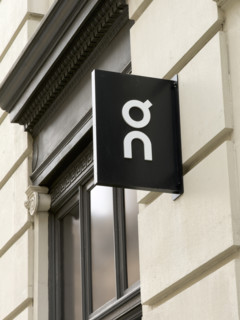 On running shoes and apparel retail store, company logo on building exterior, 162 Fifth Avenue,