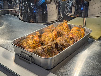 Herb-rubbed rotisserie chickens on display, Dickson's Farmstand Meats, Chelsea Market, Chelsea,