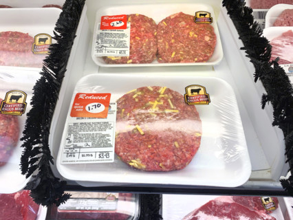 Reduced priced beef hamburger patties in grocery store