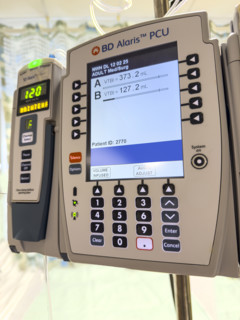 BD Alaris PCU IV pump machine in hospital room