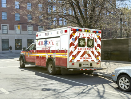 New York City Fire Department EMS ambulance parked on urban street, Chelsea, Manhattan, New York