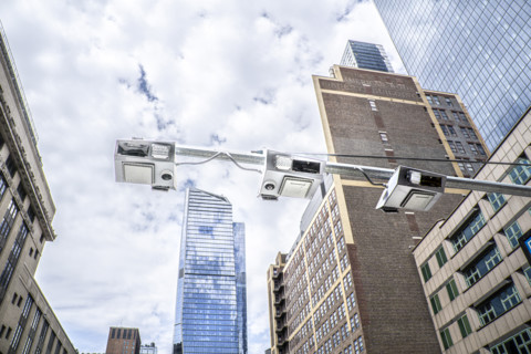 Low angle view of congestion pricing scanners with cityscape in background, Hudson Yards, New York