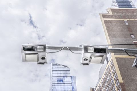 Low angle view of congestion pricing scanners with cityscape in background, Hudson Yards, New York