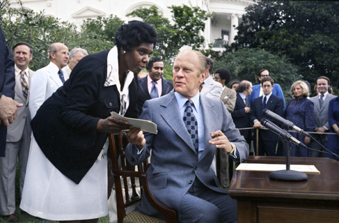 U.S. President Gerald R. Ford and U.S. Representative Barbara Jordan of Texas at signing Ceremony