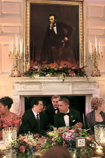 U.S. President Barack Obama and U.S. First Lady Michelle Obama sit with President Hu Jintao of
