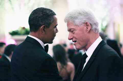 U.S. President Barack Obama talking with former U.S. President Bill Clinton during State Dinner in