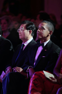 U.S. President Barack Obama and President Hu Jintao of China listen to entertainment during State