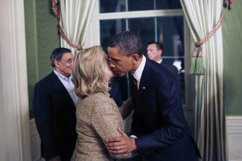 U.S. President Barack Obama kissing U.S. Secretary of State Hillary Rodham Clinton in the White