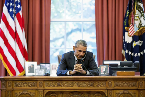 U.S. President Barack Obama talking on telephone with pastors who offer birthday prayer during call