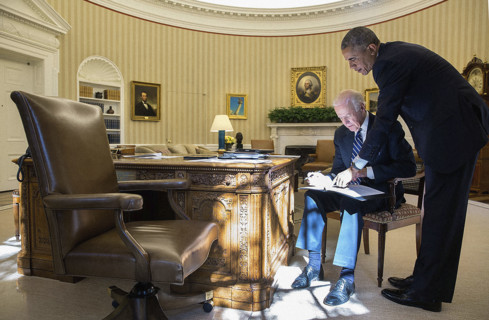 U.S. Vice President Joseph Biden reviewing his remarks with U.S. President Barack Obama before the