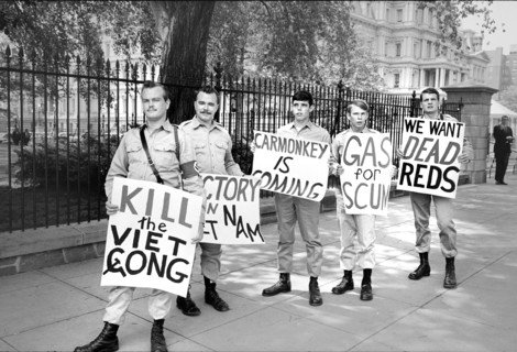 Group of American Nazi Party members with signs in support of the Vietnam War, demonstrating
