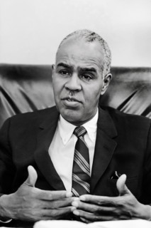 Roy Wilkins, Executive Director of the NAACP, head-and-shoulders portrait, seated, facing front,