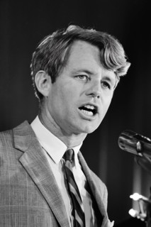 New York Senator Robert F. Kennedy of New York, speaking at a microphone at a United States Chamber