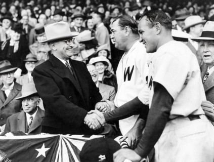 U.S. President Harry S. Truman (left) shaking hands with Washington Senators starting pitcher Bobo