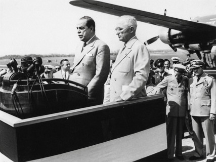 U.S. President Harry S. Truman (center-right) standing beside Romulo Gallegos (center-left),