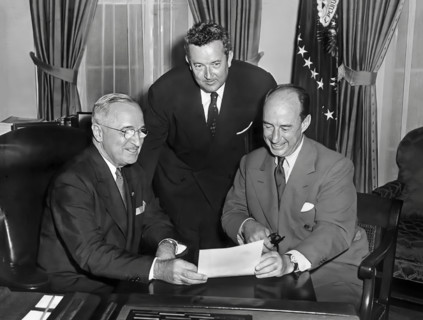 U.S. President Harry S. Truman (left) meeting with Governor Adlai Stevenson of Illinois (right) and