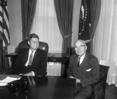 U.S. President John F. Kennedy (left) talking with former U.S. President Harry S. Truman (right) in