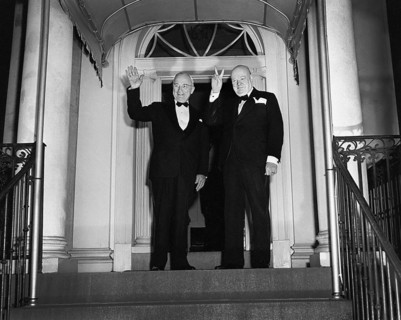 British Prime Minister Winston Churchill (right) flashing his "V for Victory" sign and U.S.