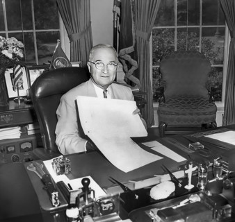 U.S. President Harry S. Truman displaying the National Security Act Amendments of 1949, which he