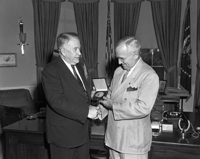 President Harry S. Truman (right) presents a Congressional Gold Medal, authorized by Congress, to U