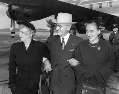 U.S. President Harry S. Truman (center) standing with U.S. First Lady Bess W. Truman (left) and