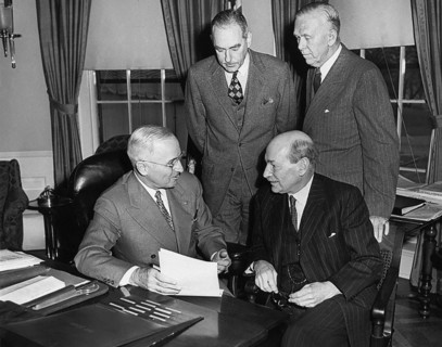British Prime Minister Clement Attlee (seated right) meeting with President Harry S. Truman (seated