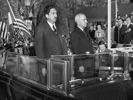 Mexican President Miguel Aleman (left) and U.S. President Harry S. Truman (right) standing in back