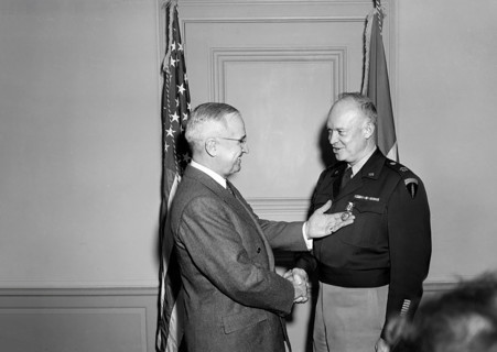 U.S. President Harry S. Truman (left) presenting U.S. General Dwight Eisenhower (right) with the