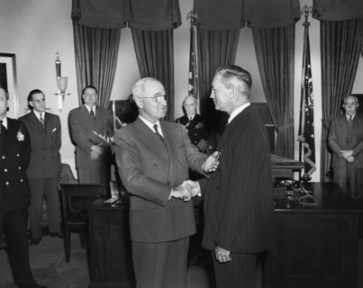 U.S. President Harry S. Truman (left) presenting Medal of Merit to U.S. Secretary of Defense James