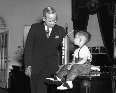 U.S. President Harry S. Truman chatting with Michael Dene Condatore in the White House Oval Office