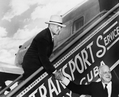 U.S. President Harry S. Truman shaking hands with White House doorkeeper William Simmons as he