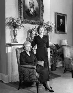 U.S. First Lady Bess Truman (left) posing with her daughter, Margaret (right), in front of