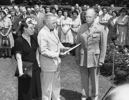 U.S. President Harry S. Truman (center) reading citation for U.S. General Dwight D. Eisenhower's