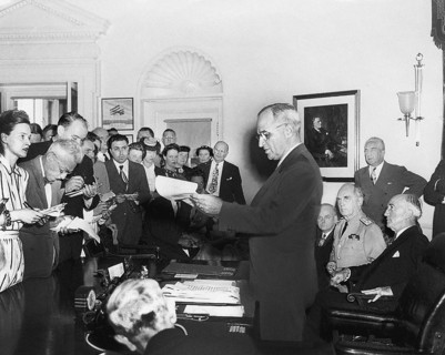 U.S. President Harry S. Truman announcing the surrender of Japan, ending World War II, to assembled