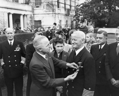 U.S. President Harry S. Truman (left foreground) giving U.S. Admiral Chester Nimitz (right