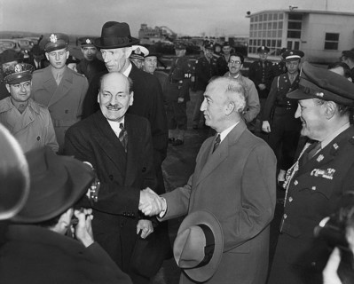 British Prime Minister Clement Attlee (foreground, third from right) shaking hands with U.S.