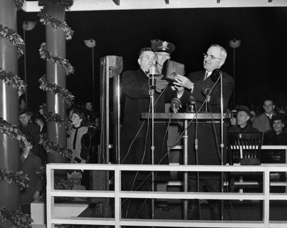 U.S. President Harry S. Truman pressing button to light the National Christmas Tree, Washington, D