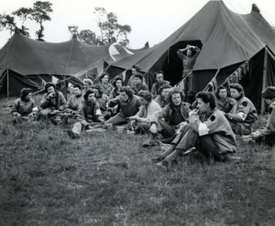 Group of U.S. Army nurses, first to land with the vanguard of American troops, eating dinner at